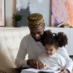 father-daughter-happy-reading-book-together